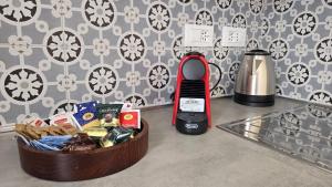 a table with a cell phone and a container of food at LA PIAZZETTA - Homy 5 Terre in Volastra