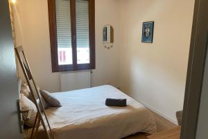 Ένα ή περισσότερα κρεβάτια σε δωμάτιο στο Zenith Urbain