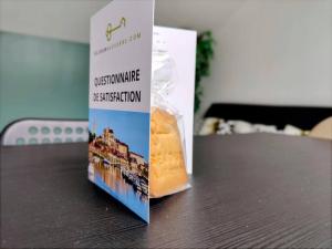 a bag of food sitting on top of a table at Perrière - Séjour à Auxerre in Auxerre