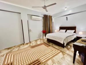 a bedroom with a bed and a desk and a bed sidx sidx sidx at joy house in Luxor