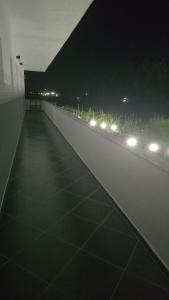 a night view of a building with lights on a street at Toska homes in Mullini i Danit