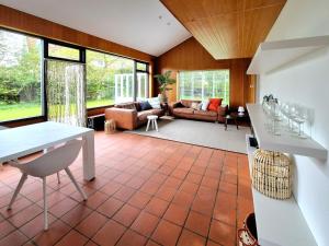 a living room with a couch and a table at de Brabander in Cadzand