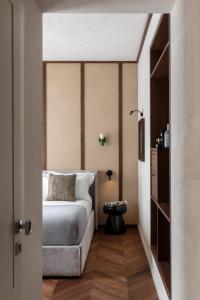 En eller flere senge i et værelse på NAMAN HOTELLERIE - Roma + 24 billeder