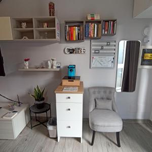 a desk and a chair in a room at Casa Mole, Roma in Marino