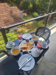 a tray of food on a table with food on it at Yala Hideaway in Tissamaharama