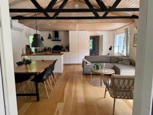 a living room with a couch and a table at 10041-1-Rorvig-Langesovej-2 in Rørvig