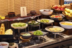 a buffet with different types of food on display at DoubleTree by Hilton Kyoto Station in Kyoto +85 photos