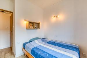 Ένα ή περισσότερα κρεβάτια σε δωμάτιο στο Maison avec terrasse climatisation