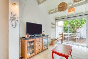 Μια τηλεόραση ή/και κέντρο ψυχαγωγίας στο Maison avec terrasse climatisation