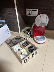 a model of a kitchen with a toaster and a box at Ground floor apartment on the seafront with pool in Vinaròs