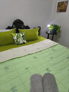 Una cama o camas en una habitación de Homestay UTI - Aurora Malioboro