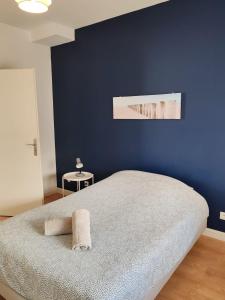 Ένα ή περισσότερα κρεβάτια σε δωμάτιο στο Échappée Bleue