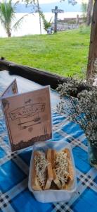 a box of food sitting on top of a table at Sarah's Cottage Toba Samosir in Ambarita