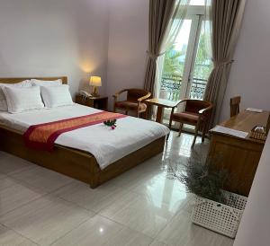 En eller flere senge i et værelse på The Sun Hotel