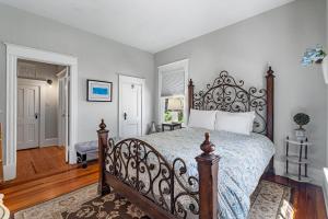 a bedroom with a large bed in a room at Old City Charm l Historic l Walk to St George in Saint Augustine
