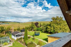 an aerial view of a garden with a house at Pur Wohnen - Wohnung Fernsicht in Niederreutern