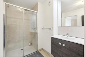 a bathroom with a shower and a sink at spacious and bright apartment in Bordeaux
