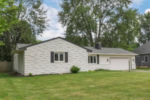 a white house with a grass yard at Spacious 4BR Ranch Near Easton Perfect for Families & Work Groups in Parks Mills