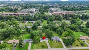 an aerial view of a campus with trees and buildings at Spacious 4BR Ranch Near Easton Perfect for Families & Work Groups in Parks Mills