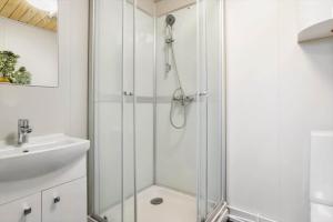 a bathroom with a shower and a sink at 20125-Samso-Spaetmejsevej-2 in Nordby +30 photos