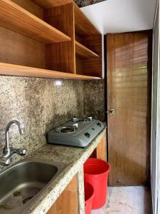 a kitchen with a sink and a counter top at Khonikaloy 19 4BHK in Gulshan 2 near United Hospital in Dhaka
