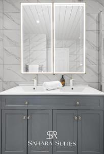 a bathroom with a sink and a mirror at Spacious 6BR - Woodley Stay - Sleeps 13 - Near City Hub - Parking in Woodley +26 photos