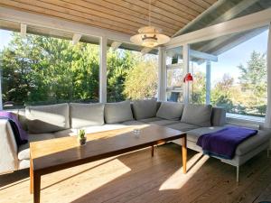 a living room with a couch and a table at 4 star holiday home in Fjerritslev in Fjerritslev
