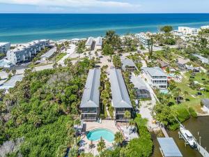 an aerial view of a resort near the ocean at Unwind with Beach Bliss & Sunset Magic - Sunburst 113 in Punta Gorda Beach