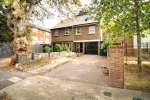 a brick house with a driveway in front of it at 3 Bed Semi - Sleeps 5 - Wifi - Private Garden & Parking - Pets Allowed in Grove Park