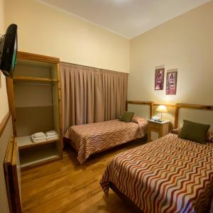 Postel nebo postele na pokoji v ubytování Hotel Ideal Resto Bar