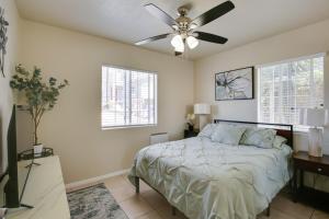 a bedroom with a bed and a ceiling fan at 4 Mi to Dtwn San Diego Cozy Getaway with Patio! in San Diego