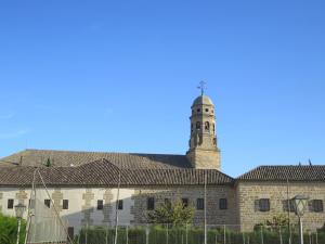 a building with a clock tower on top of it at La Casa del Seise in Baeza