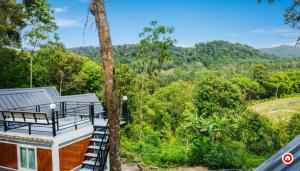 a house in the woods with a view of the forest at The Rendezvous Phangan in Ko Phangan