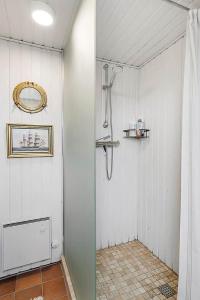 a bathroom with a shower and a shower curtain at BL1074-Saltum-Solmarken-3 in Saltum +21 photos