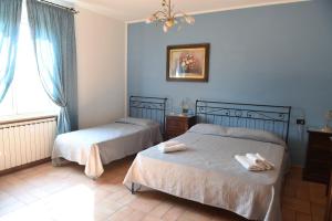 Ένα ή περισσότερα κρεβάτια σε δωμάτιο στο Agriturismo Poponi