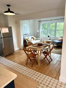 a living room with a table and a couch at Private duplex on Hudson River in Coxsackie +13 photos