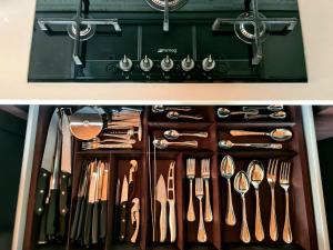 a drawer full of utensils in a kitchen at Terrazza Hikari Villacidro in Villacidro +39 photos