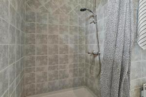 a shower with a shower curtain in a bathroom at 30171-Odder-Pouli-Nielsensvej-71 in Beder +22 photos