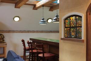 a bar in a restaurant with a stained glass window at Apartament Bałtycki in Mielno