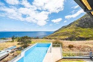 a pool with a view of the ocean at Villa Eastern Edge by Homie in Caniçal