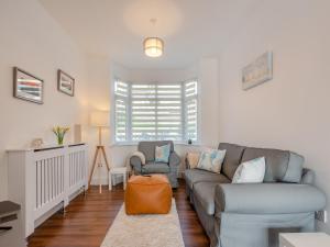 a living room with a couch and a chair at The Laurels in Goodwick