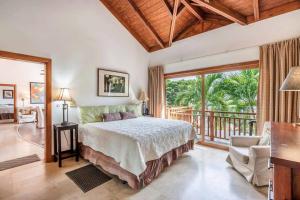 a bedroom with a bed and a balcony at Samana Ocean View Villa in Los Grini +36 photos