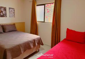 a bedroom with a bed and a window at Monte das cerejeiras - Bananeiras in Bananeiras +40 photos