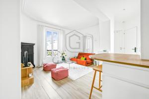 a white living room with a couch and a table at Gaspar- Passages- Comfort & proximity to Paris in Boulogne-Billancourt