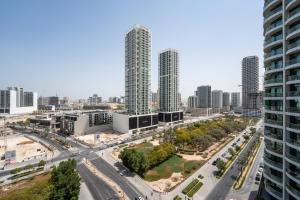 an aerial view of a city with tall buildings at Luxury Studio JVC Open View in Dubai