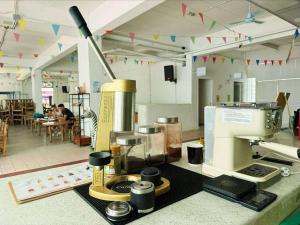 a kitchen with a counter with a mixer in a room at Green Group Stay Bangkok - Near Khaosan Road in Bangkok +66 photos