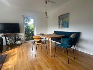 TV a/nebo společenská místnost v ubytování Ferienwohnung Bücherkiste