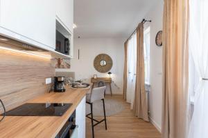 Η κουζίνα ή μικρή κουζίνα στο MW 6A Apartament +18 φωτογραφίες