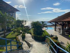 a resort with a staircase leading to the water at Duplex 301C | Alter do Chão in Alter do Chao