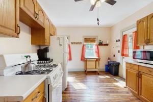 a kitchen with a stove and a white refrigerator at The Hollow in Jefferson